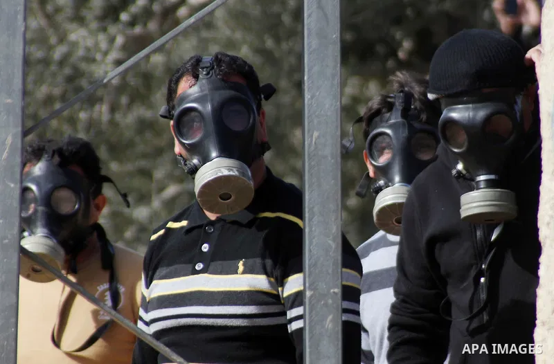 Palestinian protesters wearing gas masks take part in a demonstration against the expropriation of Palestinian land by Israel in the village of Kfar Qaddum, near Nablus in the occupied West Bank, on January 23, 2015. Pho...