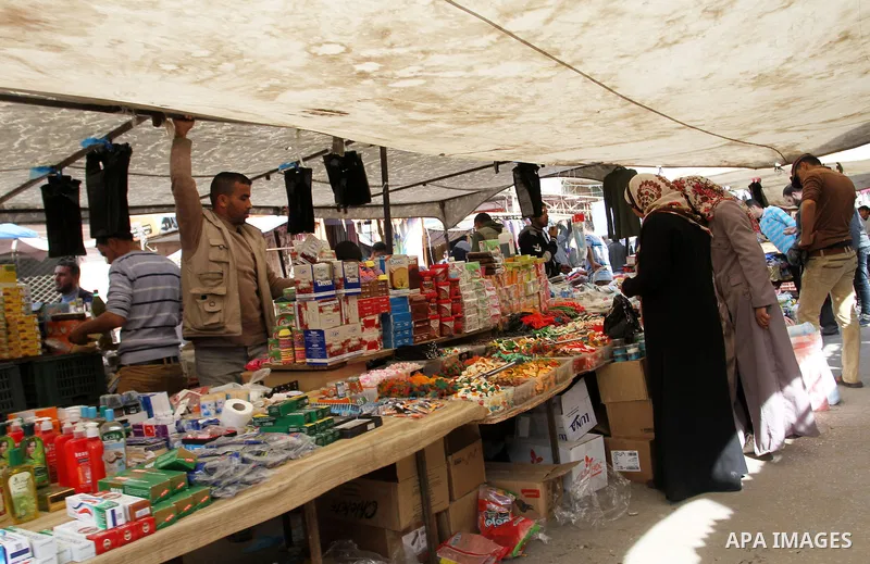 A Palestinian vendor displays the sweets at the main market in Rafah in the southern Gaza Strip on January 24, 2015. Photo by Abed Rahim Khatib