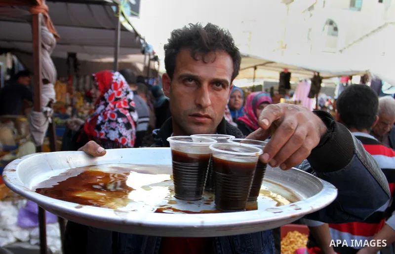 A Palestinian man sells a coffe at the main market in Rafah in the southern Gaza Strip on January 24, 2015. Photo by Abed Rahim Khatib