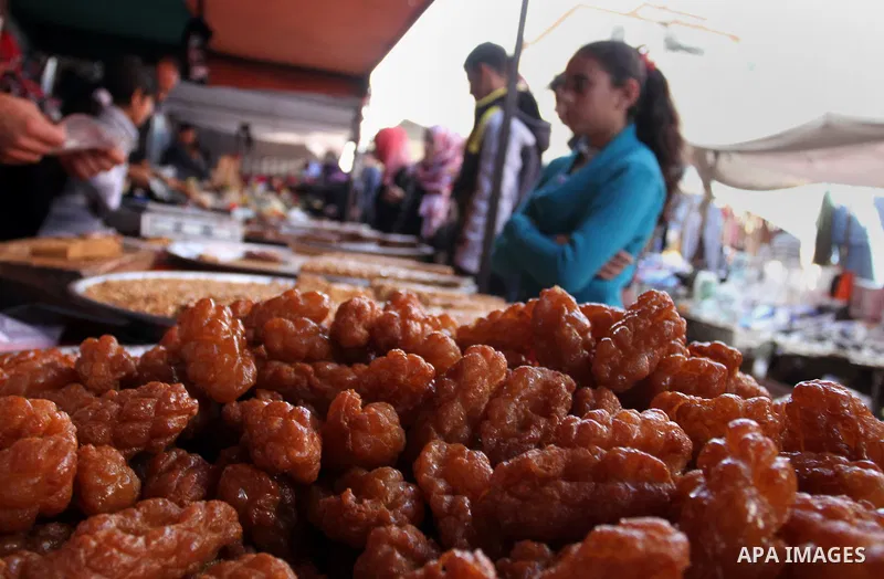 A Palestinian vendor displays the sweets at the main market in Rafah in the southern Gaza Strip on January 24, 2015. Photo by Abed Rahim Khatib