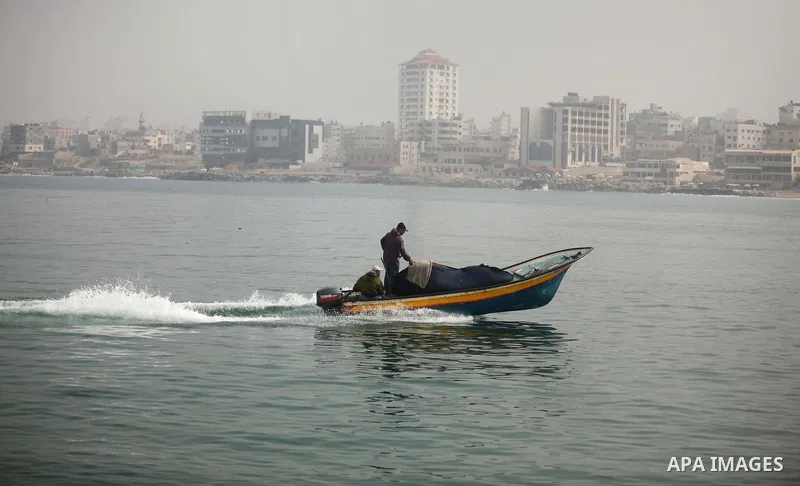 Palestinian fishermen ride their boats into the water in the port of Gaza City on January 25, 2015. Israel's navy opened fire at fishing boats off the coast of the Gaza Strip on January 21, 2015 wounding two Palestinian...