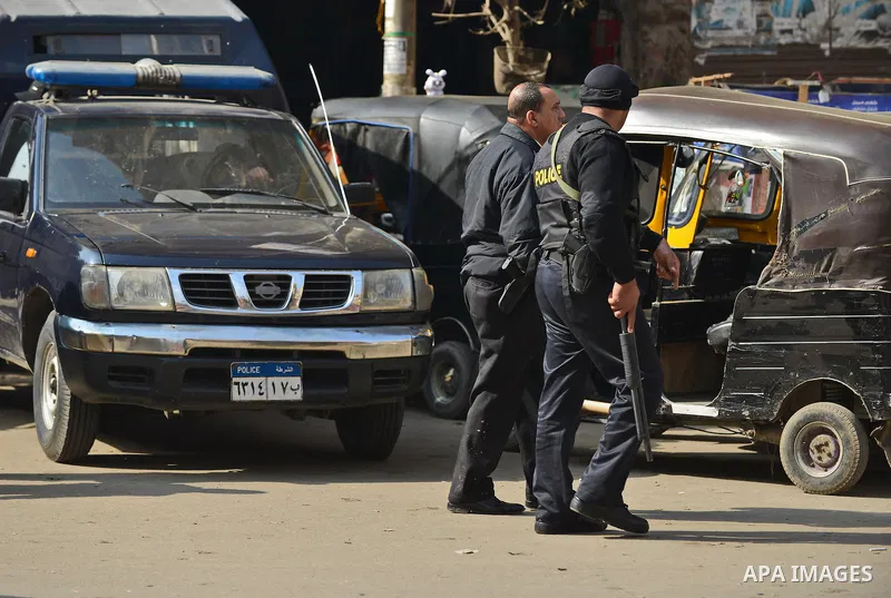 Egyptian security forces stand guard at Faisal street in Cairo January 25, 2015. A bomb wounded two Egyptian policemen in Cairo on Sunday and security forces moved quickly to disperse small protests on the anniversary of...