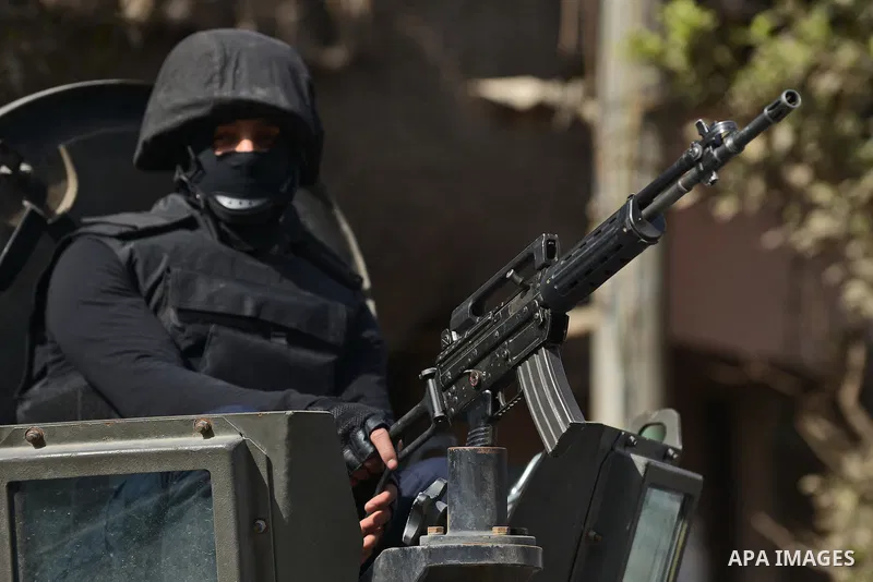 An Egyptian security force stands guard at Faisal street in Cairo January 25, 2015. A bomb wounded two Egyptian policemen in Cairo on Sunday and security forces moved quickly to disperse small protests on the anniversary...