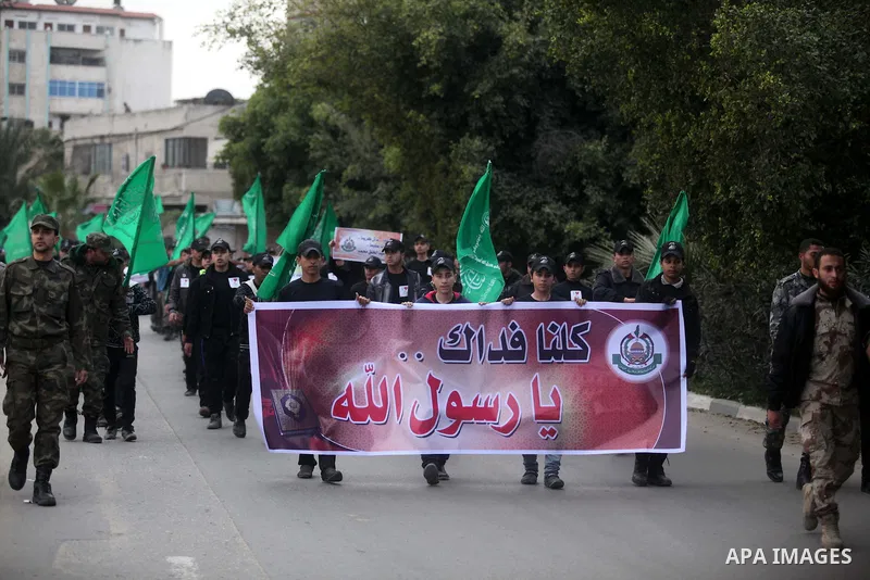 Palestinian youths, who are participants in a Hamas military-style camp, march during a rally against the cover cartoon of the Prophet Mohammed published by French satirical magazine Charlie Hebdo in Gaza city on January...