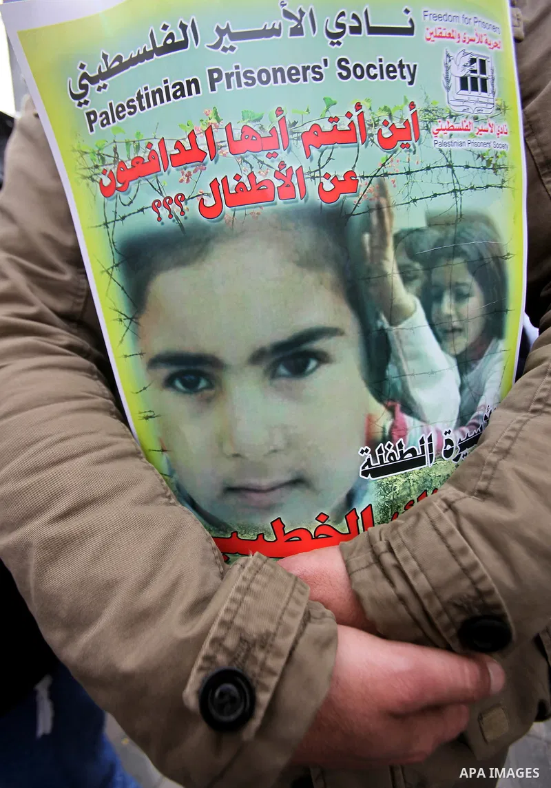 A Palestinian man holds poster during a protest to show solidarity with the prisoner of Malak Khatib in Israeli jails, in the West Bank city of nablus, on January 27, 2015. Malak Khatib, has been in Israeli detention sin...