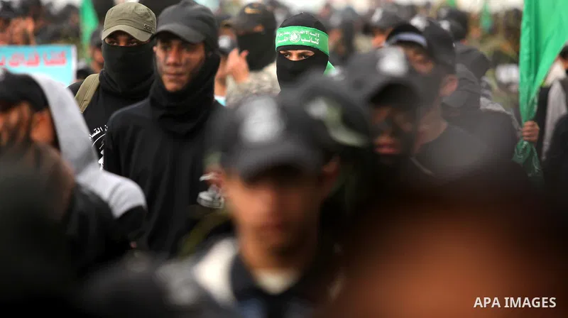 Palestinian youth, who are participating in a Hamas military-style camp, march during a protest rally in support of the Prophet Mohammed in Gaza City on January 27, 2015. Photo by Ashraf Amra