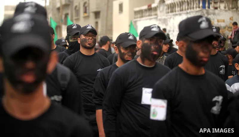 Palestinian youth, who are participating in a Hamas military-style camp, march during a protest rally in support of the Prophet Mohammed in Gaza City on January 27, 2015. Photo by Ashraf Amra