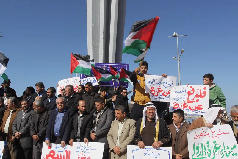 Palestinian factions members take part a protest at the Gaza seaport, on January 29, 2015. The governmental Committee to Break the Siege on Gaza declared last week the beginning of the rehabilitation of a waterway that w...