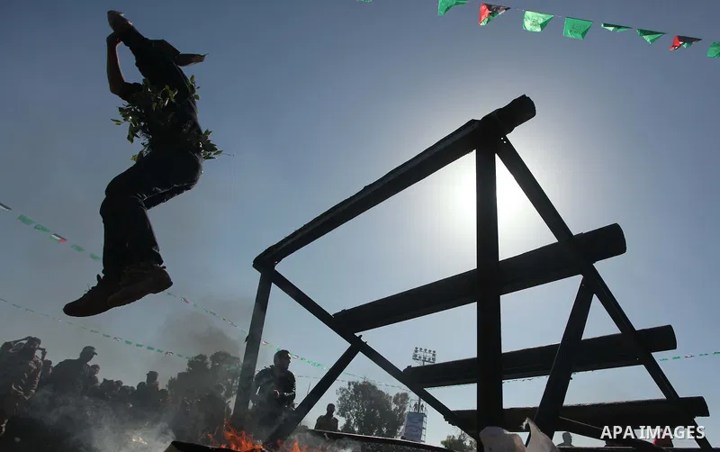Palestinian youths demonstrate their skills during a graduation ceremony of a military-style camp organized by the Hamas movement in Gaza City on January 29, 2015. Hamas's armed wing organized "Liberation Youths Camps" f...