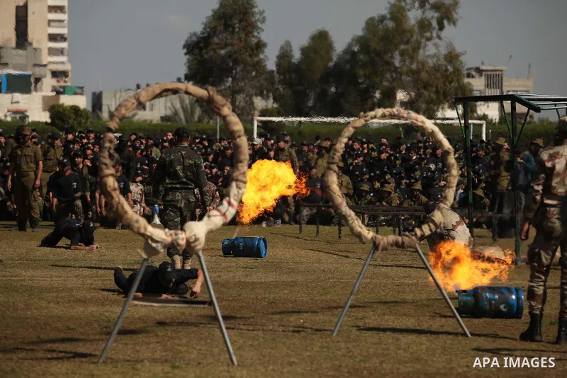 Palestinian youths demonstrate their skills during a graduation ceremony of a military-style camp organized by the Hamas movement in Gaza City on January 29, 2015. Hamas's armed wing organized "Liberation Youths Camps" f...