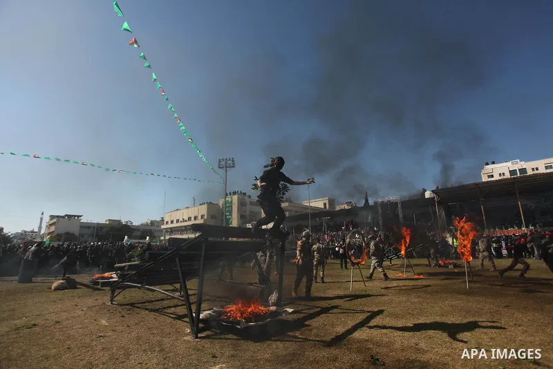 Palestinian youths demonstrate their skills during a graduation ceremony of a military-style camp organized by the Hamas movement in Gaza City on January 29, 2015. Hamas's armed wing organized "Liberation Youths Camps" f...