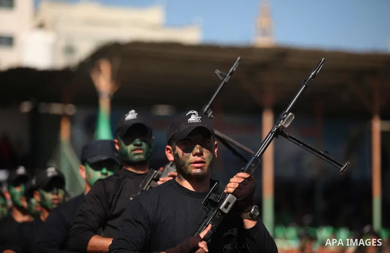Palestinian youths demonstrate their skills during a graduation ceremony of a military-style camp organized by the Hamas movement in Gaza City on January 29, 2015. Hamas's armed wing organized "Liberation Youths Camps" f...