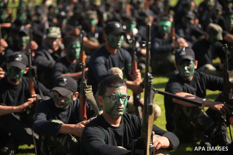 Palestinian youths demonstrate their skills during a graduation ceremony of a military-style camp organized by the Hamas movement in Gaza City on January 29, 2015. Hamas's armed wing organized "Liberation Youths Camps" f...