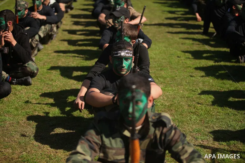 Palestinian youths demonstrate their skills during a graduation ceremony of a military-style camp organized by the Hamas movement in Gaza City on January 29, 2015. Hamas's armed wing organized "Liberation Youths Camps" f...
