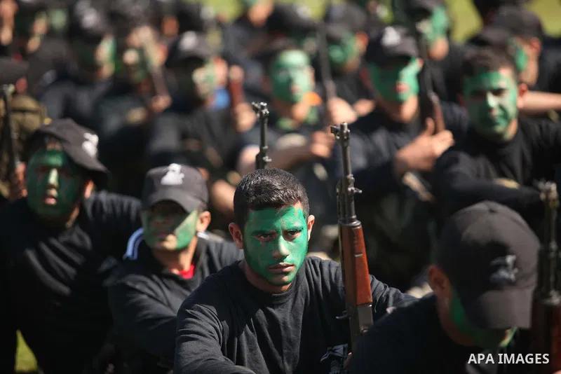 Palestinian youths demonstrate their skills during a graduation ceremony of a military-style camp organized by the Hamas movement in Gaza City on January 29, 2015. Hamas's armed wing organized "Liberation Youths Camps" f...