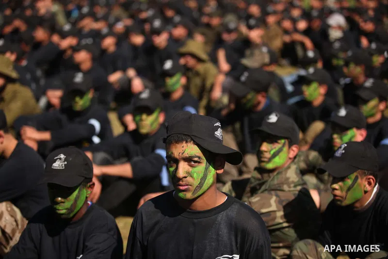Palestinian youths demonstrate their skills during a graduation ceremony of a military-style camp organized by the Hamas movement in Gaza City on January 29, 2015. Hamas's armed wing organized "Liberation Youths Camps" f...