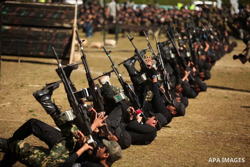 Palestinian youths demonstrate their skills during a graduation ceremony of a military-style camp organized by the Hamas movement in Gaza City on January 29, 2015. Hamas's armed wing organized "Liberation Youths Camps" f...