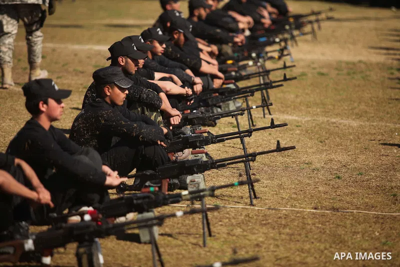 Palestinian youths demonstrate their skills during a graduation ceremony of a military-style camp organized by the Hamas movement in Gaza City on January 29, 2015. Hamas's armed wing organized "Liberation Youths Camps" f...