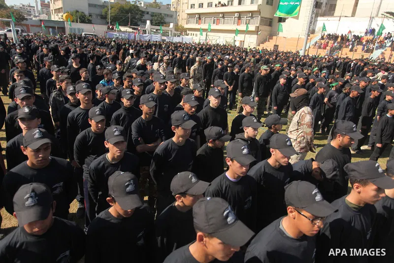 Palestinian youths demonstrate their skills during a graduation ceremony of a military-style camp organized by the Hamas movement in Gaza City on January 29, 2015. Hamas's armed wing organized "Liberation Youths Camps" f...