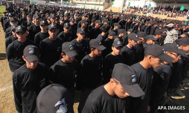 Palestinian youths demonstrate their skills during a graduation ceremony of a military-style camp organized by the Hamas movement in Gaza City on January 29, 2015. Hamas's armed wing organized "Liberation Youths Camps" f...