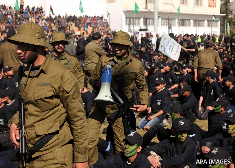 Palestinian youths demonstrate their skills during a graduation ceremony of a military-style camp organized by the Hamas movement in Gaza City on January 29, 2015. Hamas's armed wing organized "Liberation Youths Camps" f...