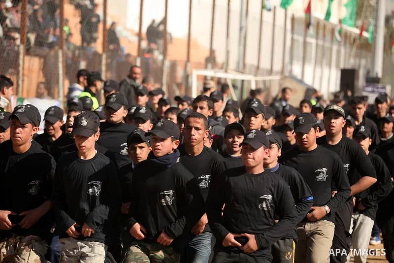 Palestinian youths demonstrate their skills during a graduation ceremony of a military-style camp organized by the Hamas movement in Gaza City on January 29, 2015. Hamas's armed wing organized "Liberation Youths Camps" f...
