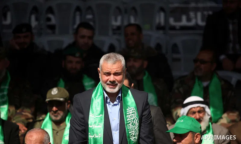 Senior Hamas leader Ismail Haniyeh attends a graduation ceremony of a military-style camp organized by his movement in Gaza City on January 29, 2015. Hamas's armed wing organized "Liberation Youths Camps" for young Pales...