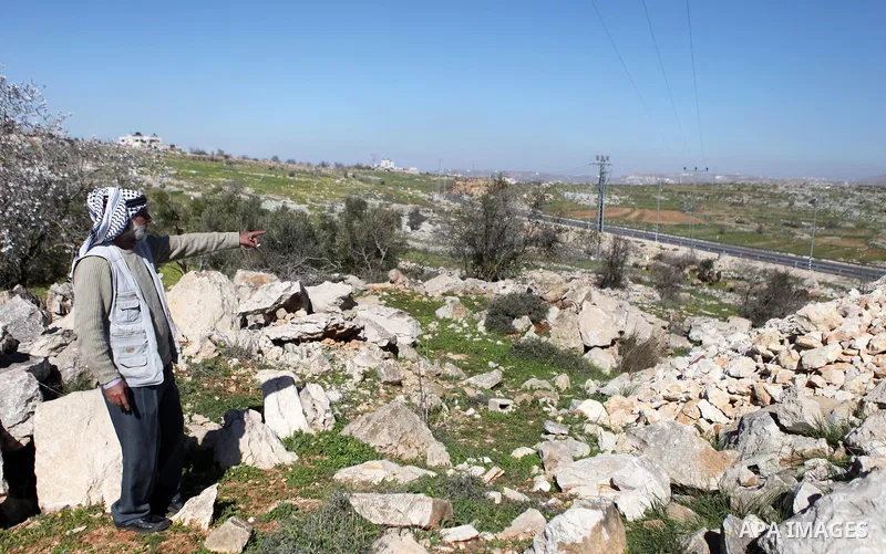 Palestinian Ali al-Khatib, father of 14-year old-daughter Malak al-Khatib, detained in Israel, points at the place where his daughter was arrested, in the village of Beitin near the West Bank city of Ramallah, on January...