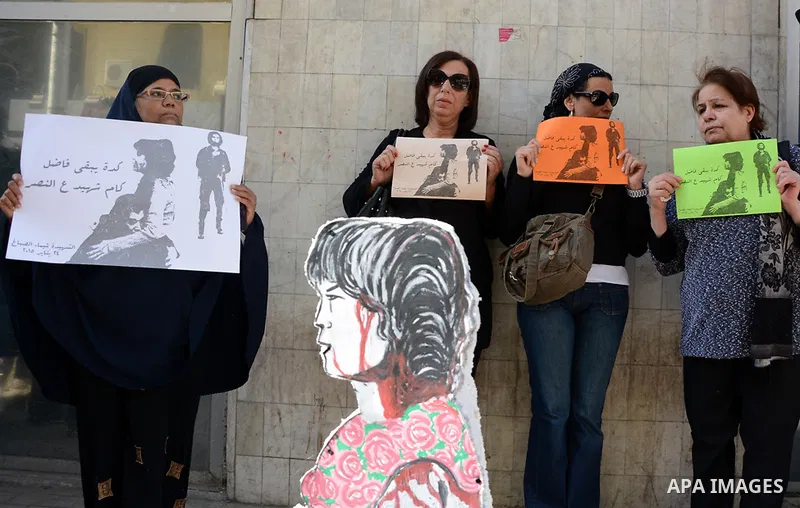 Egyptian women hold placards during a demonstration against the killing of Shaima al-Sabbagh, who was killed during clashes with Egyptian police on January 24, in Cairo on January 29, 2015. Al-Sabbagh was killed in clash...