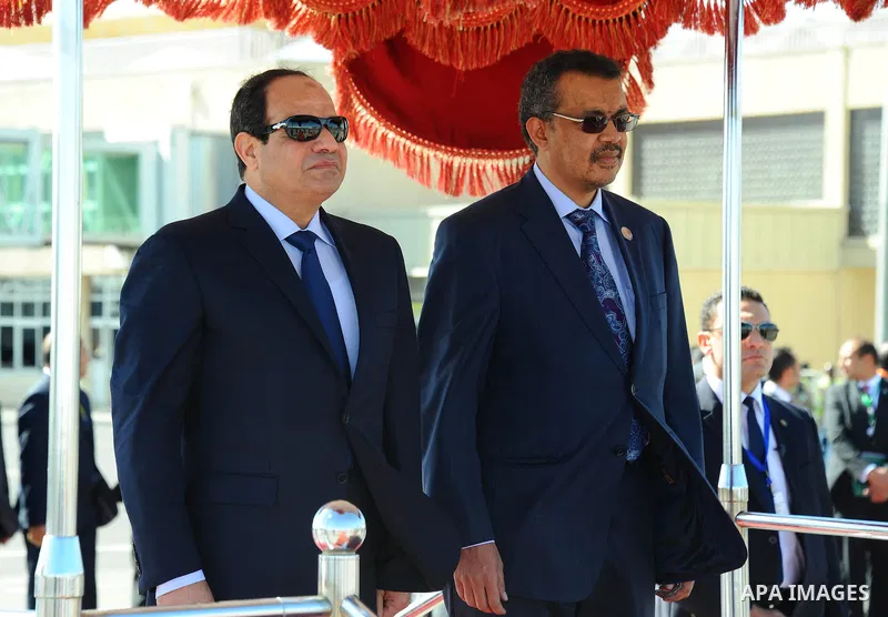 A handout picture made available by the Office of the Egyptian President shows Ethiopian Foreign Minister, Tedros Adhanom Ghebreyesus (R), and Egyptian President, Abdel Fattah al-Sisi (L), reviewing the honor guard short...
