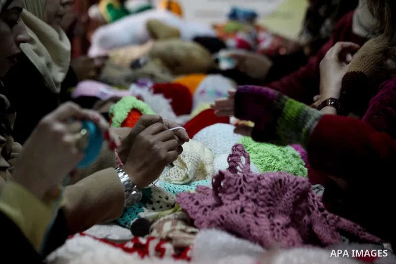 Palestinian women weave wool at Edward Foundation in the West Bank city of Hebron, January 31, 2015. Edward Foundation Marketing products of the Palestinian heritage at the global markets through the display in exhibitio...