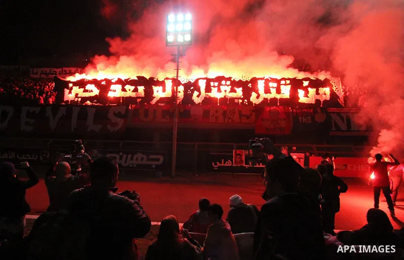 Al Ahly fans, also known as "Ultras", light flares and shout slogans at al-Ahly club's training stadium marking the third anniversary of killing al-Ahly fans in what known as the "Port Said massacre", on February 1, 2015...