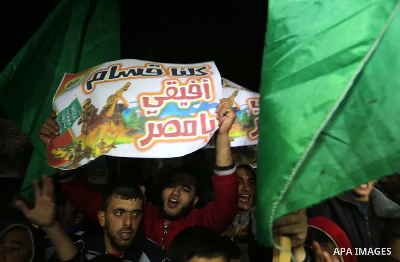 Palestinian supporters of Hamas movement shout slogans during a rally against the Egyptian court decision to list Ezz Eddin al-Qassam brigades as a "terrorist group", in Jabalia in the northern Gaza Strip, February 2, 20...