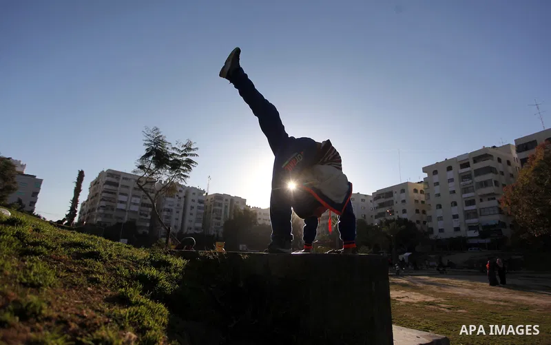 Mohammed El-sheikh, a 11-year-old Palestinian boy, demonstrates his skills at a garden, in Gaza city on February 3, 2015. El-sheikh is a extremely flexible young, who’s been training for only a year without any professio...