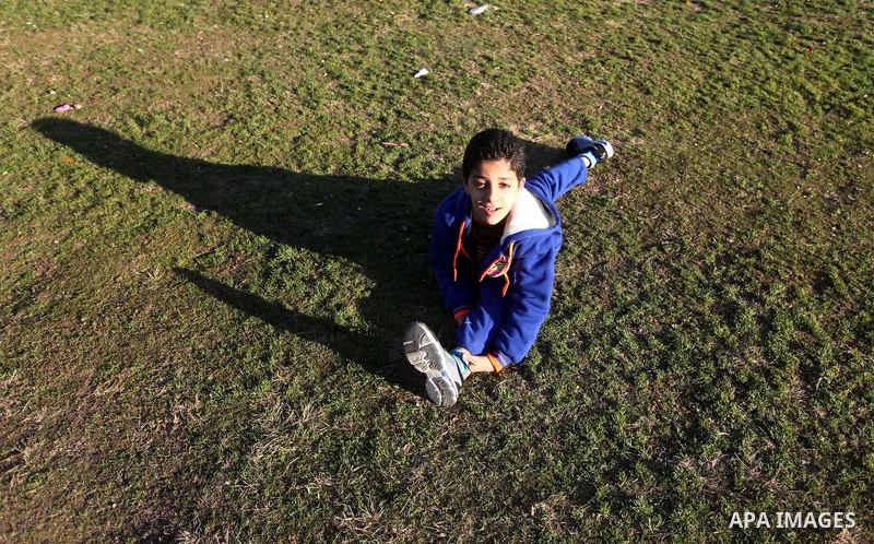 Mohammed El-sheikh, a 11-year-old Palestinian boy, demonstrates his skills at a garden, in Gaza city on February 3, 2015. El-sheikh is a extremely flexible young, who’s been training for only a year without any professio...