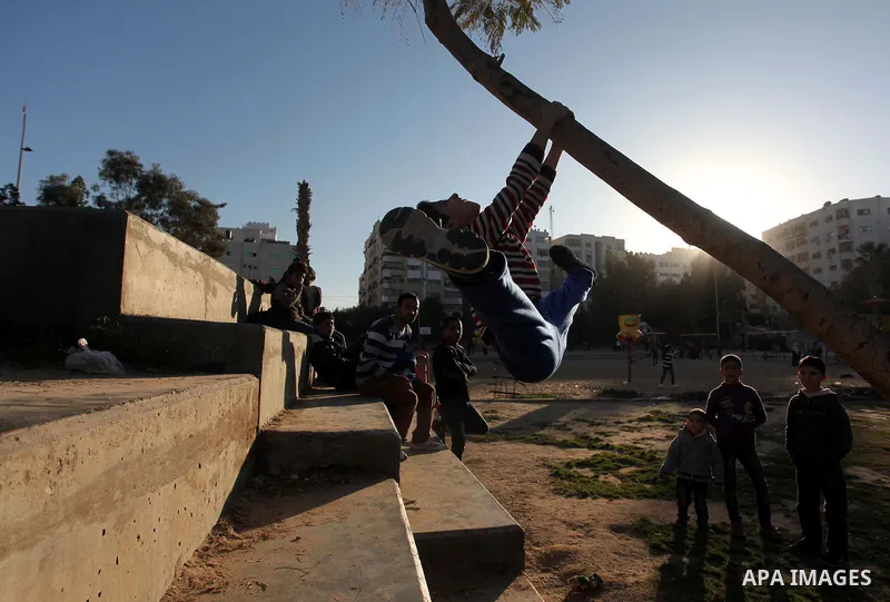 Mohammed El-sheikh, a 11-year-old Palestinian boy, demonstrates his skills at a garden, in Gaza city on February 3, 2015. El-sheikh is a extremely flexible young, who’s been training for only a year without any professio...