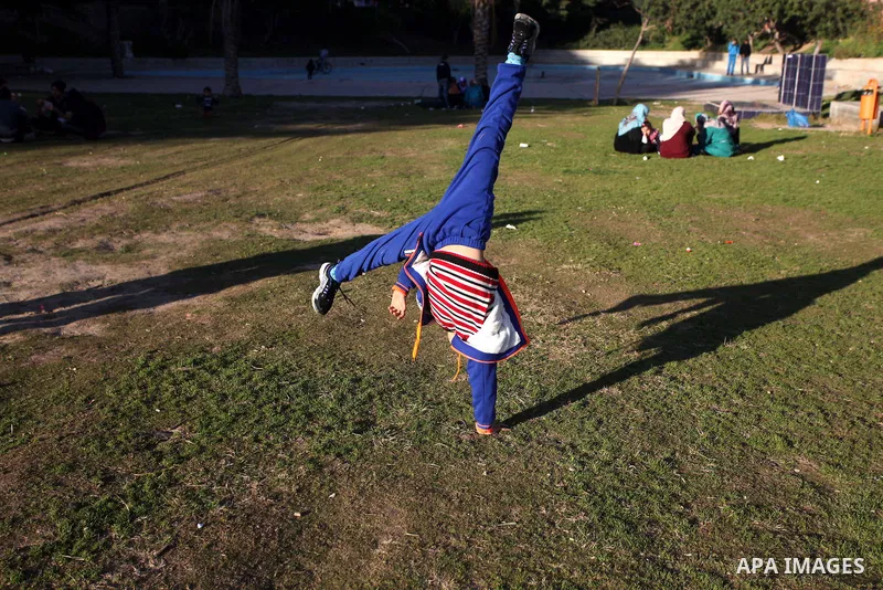 Mohammed El-sheikh, a 11-year-old Palestinian boy, demonstrates his skills at a garden, in Gaza city on February 3, 2015. El-sheikh is a extremely flexible young, who’s been training for only a year without any professio...