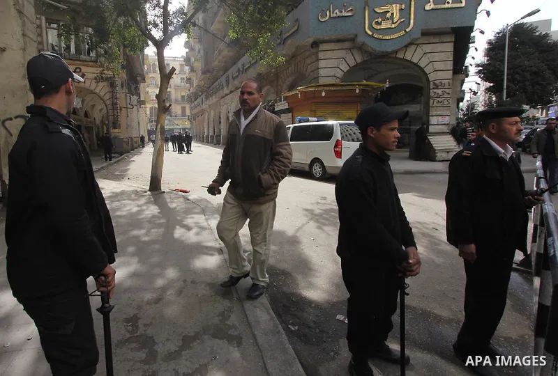 Egyptian soldiers stand guard on the blast site in downtown Cairo, Egypt, Feb. 3, 2015. A blast occurred at Talaat Harb square in downtown Cairo, leaving no casualties, an official source at Cairo Security Directorate wa...