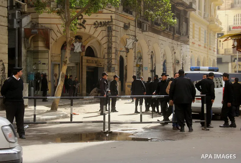 Egyptian soldiers stand guard on the blast site in downtown Cairo, Egypt, Feb. 3, 2015. A blast occurred at Talaat Harb square in downtown Cairo, leaving no casualties, an official source at Cairo Security Directorate wa...