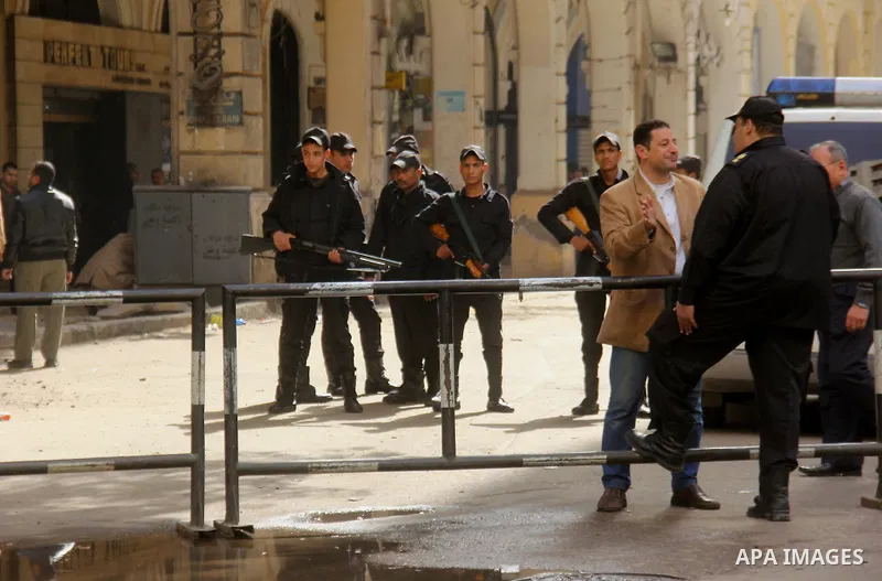 Egyptian soldiers stand guard on the blast site in downtown Cairo, Egypt, Feb. 3, 2015. A blast occurred at Talaat Harb square in downtown Cairo, leaving no casualties, an official source at Cairo Security Directorate wa...