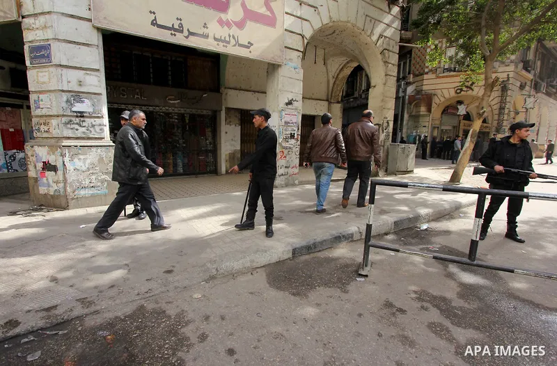 Egyptian soldiers stand guard on the blast site in downtown Cairo, Egypt, Feb. 3, 2015. A blast occurred at Talaat Harb square in downtown Cairo, leaving no casualties, an official source at Cairo Security Directorate wa...
