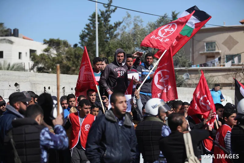 Palestinian supporters of the Popular Front for the Liberation of Palestine (PFLP) take part a protest in front of the headquarters of the United Nations in Gaza city on February 3, 2015 after the UN announced a lack of...