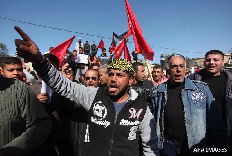 Palestinian supporters of the Popular Front for the Liberation of Palestine (PFLP) take part a protest in front of the headquarters of the United Nations in Gaza city on February 3, 2015 after the UN announced a lack of...