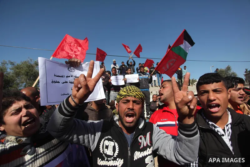 Palestinian supporters of the Popular Front for the Liberation of Palestine (PFLP) take part a protest in front of the headquarters of the United Nations in Gaza city on February 3, 2015 after the UN announced a lack of...