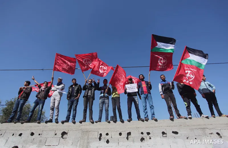 Palestinian supporters of the Popular Front for the Liberation of Palestine (PFLP) take part a protest in front of the headquarters of the United Nations in Gaza city on February 3, 2015 after the UN announced a lack of...