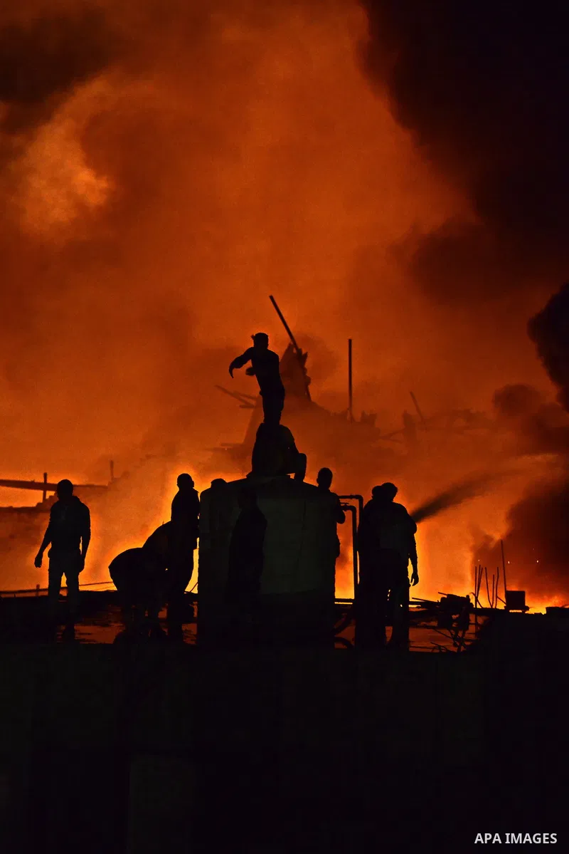 Egyptian firefighters try to extinguish a fire in a perfume factory due to an electrical malfunction in the backup power system in El-Haram district near Cairo, February 3, 2015. Photo by Amr Sayed