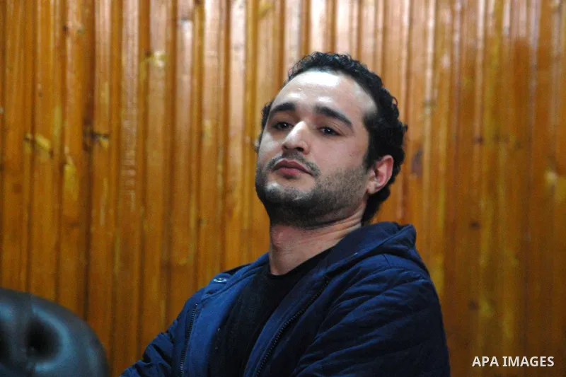 Egyptian political activist Ahmed Douma attends his trial in Cairo, February 4, 2015. An Egyptian court sentenced prominent activist Douma to life in prison on Wednesday, judicial sources said, part of a sustained crackd...