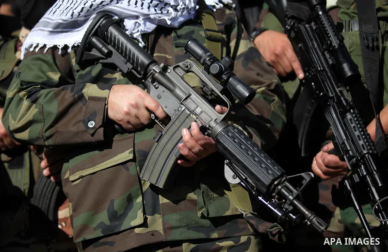 Representatives of various Palestinian armed factions take part in a news conference to condemn the decision of an Egyptian court that banned Hamas' armed wing, in Gaza City February 5, 2015. An Egyptian court last week...