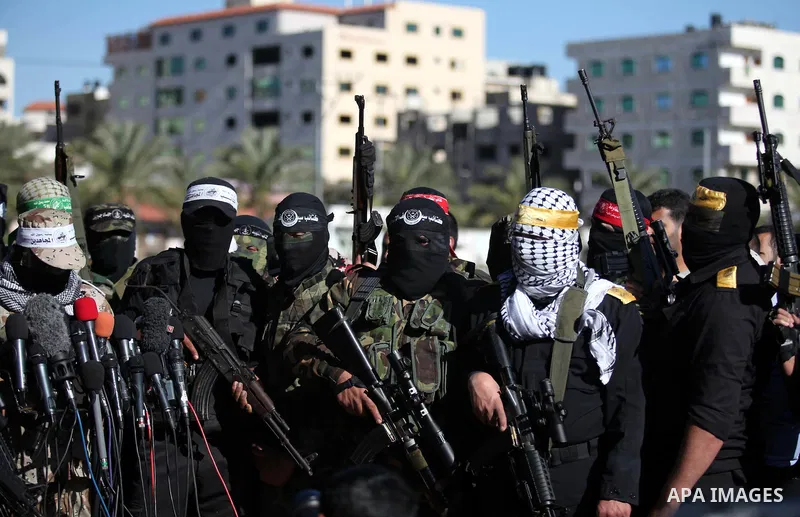 Representatives of various Palestinian armed factions take part in a news conference to condemn the decision of an Egyptian court that banned Hamas' armed wing, in Gaza City February 5, 2015. An Egyptian court last week...