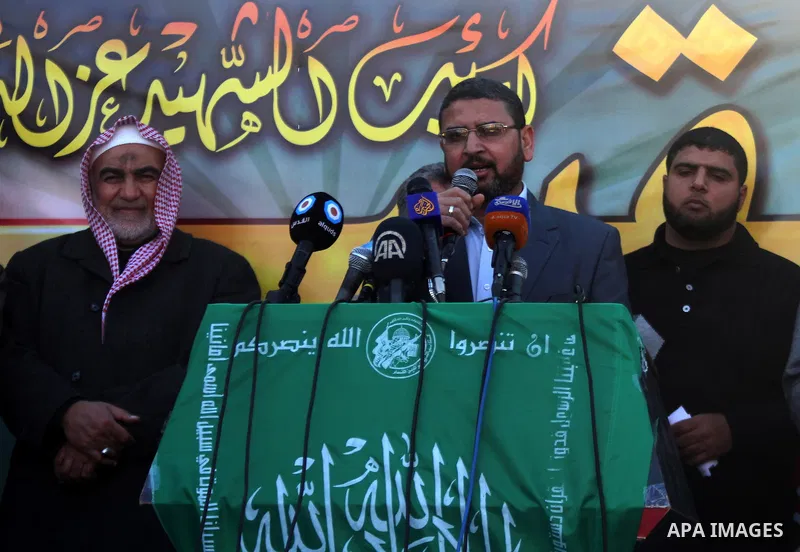 Spokesman of Palestinian Hamas movement Sami Abu Zohri, gives a speech during a rally to condemn the decision of an Egyptian court to ban the armed wing of Palestinian Islamist movement, near the Rafah border between sou...